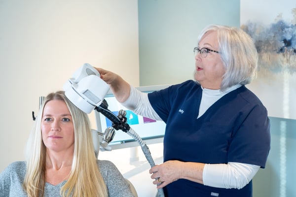 clinician-placing-tms-coil-on-patient-head-2