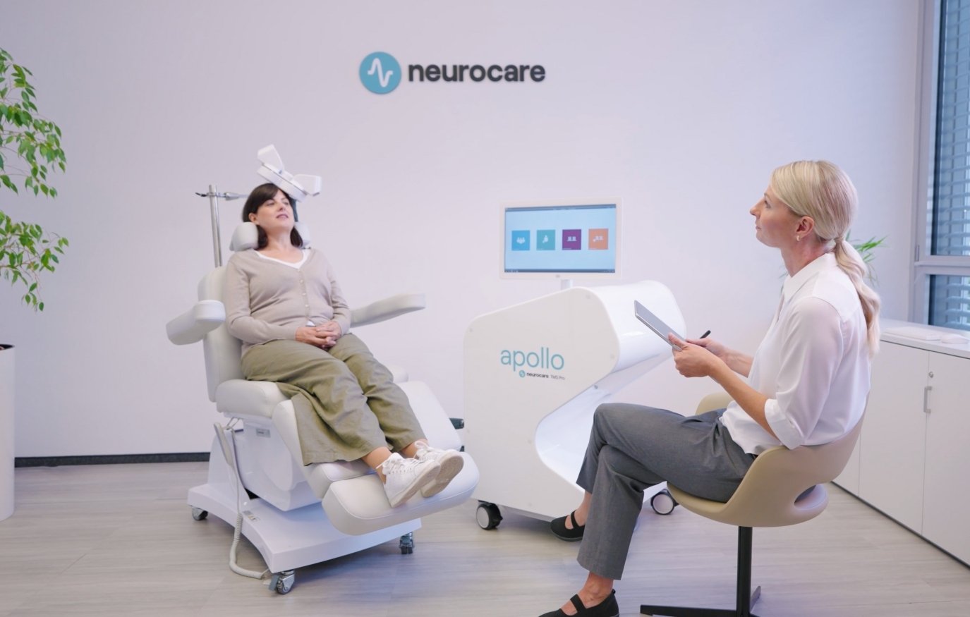 neurocare-apollo-tms-therapy-patient-practitioner-still