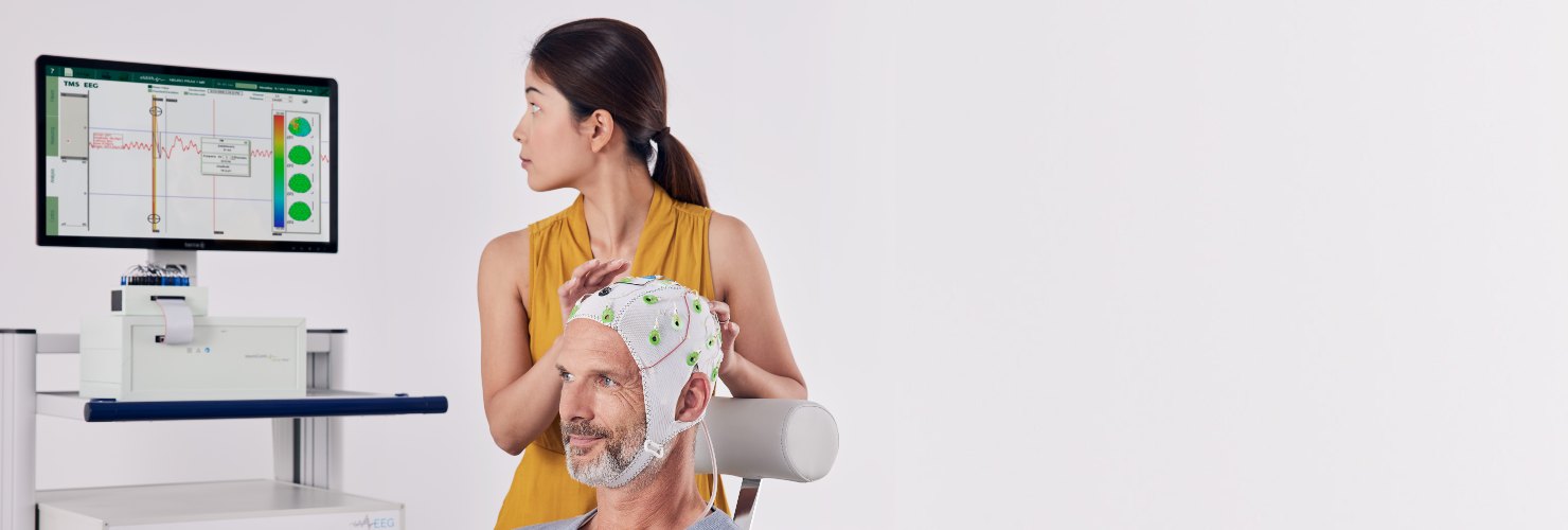 qeeg-cap-on-patient-with-technician